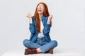 Studio portrait satisfied, happy and relieved redhead female, teen girl celebrating winning prize, triumphing sitting on