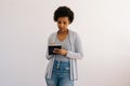 Studio portrait of serious pensive African American female writing down in notebook diary remind memories and make list Royalty Free Stock Photo