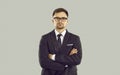 Studio portrait of serious young businessman in classic suit, shirt, tie and glasses Royalty Free Stock Photo