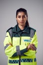 Studio Portrait Of Serious Young Female Paramedic Against Plain Background Royalty Free Stock Photo