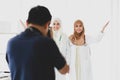 Studio portrait shot of two adult Muslim female doctors with cute smiling, looking at the camera and showing a thumb up gesture. Royalty Free Stock Photo