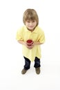 Studio Portrait of Smiling Boy Holding Glass of Fr Royalty Free Stock Photo