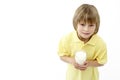 Studio Portrait of Smiling Boy Holding Glass of Mi