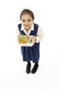 Studio Portrait of Smiling Girl Holding Lunchbox Royalty Free Stock Photo