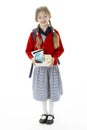 Studio Portrait of Smiling Girl Holding Lunchbox Royalty Free Stock Photo