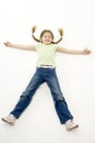 Studio Portrait of Smiling Girl lying down with ar