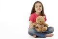 Studio Portrait Of Smiling Girl with Teddy Bear Royalty Free Stock Photo