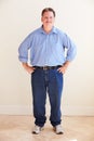 Studio Portrait Of Smiling Overweight Man Royalty Free Stock Photo