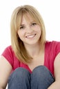 Studio Portrait Of Smiling Teenage Girl