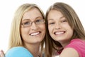 Studio Portrait of Smiling Teenage Girl with older Royalty Free Stock Photo