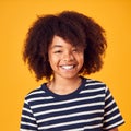 Studio Portrait Of Smiling Young Boy Shot Against Yellow Background Royalty Free Stock Photo