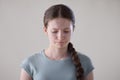 Studio Portrait Of Stressed Uncertain Teenage Girl Worried About Mental Health Issues Or Bullying Looking Down Royalty Free Stock Photo