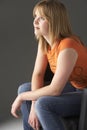 Studio Portrait Of Teenage Girl Sitting In Chair Royalty Free Stock Photo