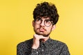 Studio portrait of a young man on a yellow background. Royalty Free Stock Photo