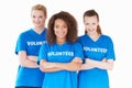 Studio Portrait Of Three Women Wearing Volunteer T Shirts