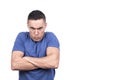 Man with crossed arms and angry scowl
