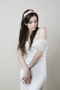 Studio portrait of a young beautiful bride in a white dress Royalty Free Stock Photo