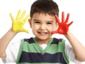 Studio Portrait Of Young Boy With Painted Hands Royalty Free Stock Photo