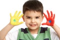 Studio Portrait Of Young Boy With Painted Hands Royalty Free Stock Photo