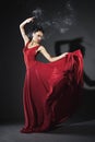 Studio portrait of young dancing woman