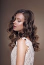 Studio Portrait of Young Dreamy Brunette with Closed Eyes