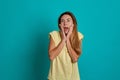 Studio portrait of a young fair-haired beautiful girl. Emotions of a girl on a blue background Royalty Free Stock Photo