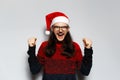 Studio portrait of young handsome happiness man with long hair, celebrate his triumph, doing winning gesture with both hands, Royalty Free Stock Photo