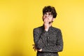 Studio portrait of a young man on a yellow background. Royalty Free Stock Photo