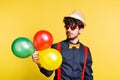 Studio portrait of a young man on a yellow background. Royalty Free Stock Photo