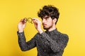 Studio portrait of a young man on a yellow background. Royalty Free Stock Photo