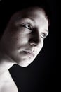 Studio portrait of a young mysterious woman