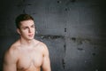 Studio portrait young men bodybuilder athlete, with a bare torso Royalty Free Stock Photo