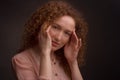 Studio portrait of a young woman with curly hair Royalty Free Stock Photo