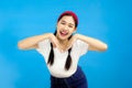 Studio Portriat of Young Asian Woman isolated on blue background, active lifestyle summer concept