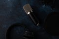 Studio professional microphone with earphone top view, blogger, streamer working with sound, on a blue background with space Royalty Free Stock Photo