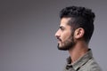 Studio profile portrait of young bearded man