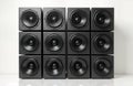 Studio quality square speaker boxes in black. High-powered speakers arranged in grid pattern. Pro audio equipment. Ideal for Royalty Free Stock Photo