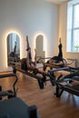Studio reformer class dynamics, energetic group pilates reformer session with focused movement Royalty Free Stock Photo
