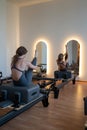 Studio reformer class dynamics, energetic group pilates reformer session with focused movement Royalty Free Stock Photo