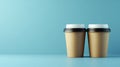 In a studio setting, a background of beverages features two disposable coffee cups in soft pastel shades Royalty Free Stock Photo