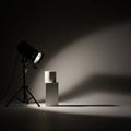A studio setup features a professional spotlight on a tripod casting a focused beam Royalty Free Stock Photo