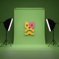 Studio setup with a green backdrop and two softbox lights on either side. A stylized Royalty Free Stock Photo