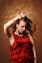 Studio shoot of beautiful woman in red dress