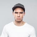 Portrait of angry young man in baseball cap Royalty Free Stock Photo