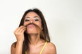 Portrait of Asian businesswoman using hair as mustache