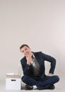 Studio shot of attractive positive thinking businessman with off