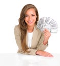 The currency of success. Studio shot of an attractive young businesswoman holding a large sum of money. Royalty Free Stock Photo