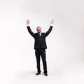 Beardy businessman raising his hands up