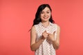 Studio shot of a beautiful girl teenager posing over a pink background. Royalty Free Stock Photo