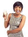 Champagne makes me giddy. Studio shot of a beautiful young woman in a sequin dress holding a glass of champagne isolated Royalty Free Stock Photo